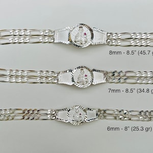 May include: Three silver bracelets with a central decorative element featuring a figure. The bracelets have different widths and lengths, with the following measurements: 8mm - 8.5", 7mm - 8.5", and 6mm - 8".