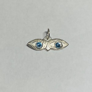 Sterling silver "Ojos de Santa Lucia"-hänge med Sankta Lucias ögon och födelsesten