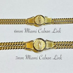 May include: Two gold Cuban link bracelets with a religious pendant. The top bracelet is 6mm wide and the bottom bracelet is 7mm wide.
