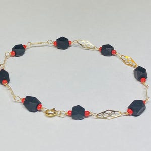 14 Karat Yellow Gold Filled Genuine Azabache Jet and Coral Accent 8&quot; Plaque Bracelet