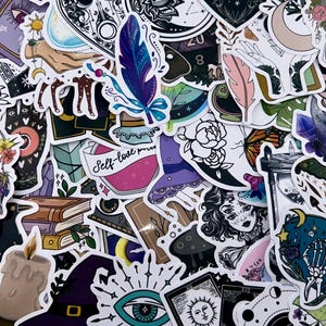May include: A collection of colorful stickers with mystical and witchy themes. Designs include a feather, potion bottle with "Self-love potion" text, a witch's hat, tarot cards, and a woman's face.