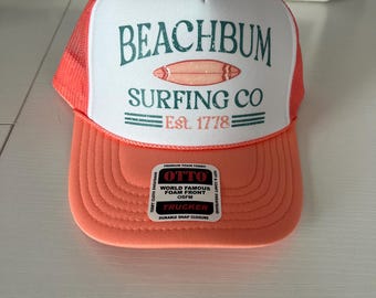 Coral “Beach Bum Surfing Co.” Trucker Hat  – Beach, Pool, Summer, Vacation, Spring Break