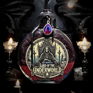May include: A glass bottle with a black stopper and a red gem pendant. The bottle is filled with a red liquid and glitter. The label on the bottle reads "Ayre Apothecary Lord of the Underworld".