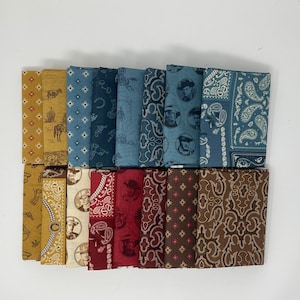 May include: A collection of folded fabric squares with various Western-themed patterns. The fabrics feature designs in shades of blue, brown, red, and yellow, with images of cowboys, horses, and paisley motifs. The fabrics are arranged in a rectangular shape.