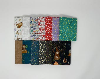 May include: A collection of folded fabric squares with various patterns. Designs include mushrooms, dots, woodland creatures, and botanical prints. Colors range from red and green to purple and brown.