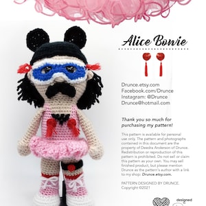 May include: Crochet amigurumi doll pattern for a character with black hair, a pink tutu, and a blue mask. The doll is wearing red and white accessories. The pattern is available for personal use only. The pattern is designed by Drunce.