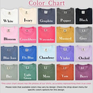 May include: A color chart displaying various t-shirt colors, including white, ivory, black, and grey. Other colors include blossom, crunchberry, and watermelon. The text "Color Chart" is at the top.