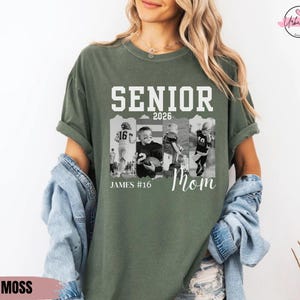 May include: Moss green t-shirt with the text "SENIOR 2026 Mom" in white. The shirt features a collage of black and white photos of a football player. The name "JAMES #16" is printed below the photos.