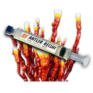 May include: A syringe labeled "RF Antler Reishi" rests on a cluster of red, orange, and yellow fungi. The syringe is clear with a black plunger and a label that includes the text "Type: Aerated Date:"