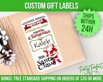 May include: A white Christmas gift label with red and green text that reads "REINDEER AIRMAIL NORTH POLE EXPRESS DELIVERY Merry Christmas Kaleb FROM: Santa Claus". A Santa Claus graphic is also included.