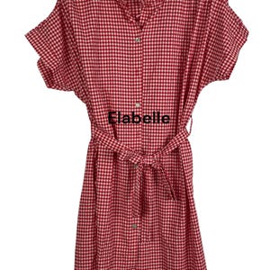 May include: Red and white gingham dress with short sleeves and a matching belt. The dress has a button-down front and the text "Elabelle" is visible on the front.