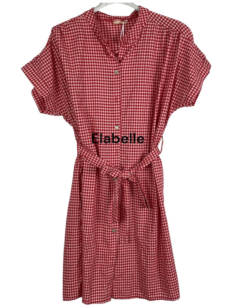 May include: Red and white gingham dress with short sleeves and a matching belt. The dress has a button-down front and the text "Elabelle" is visible on the front.