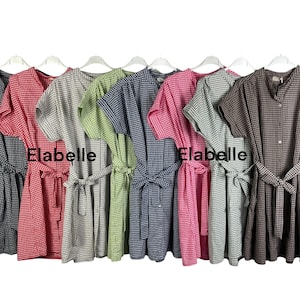 May include: A collection of short-sleeved dresses in various colors, including black, red, gray, green, blue, pink, and brown. Each dress features a gingham pattern, a matching belt, and the word "Elabelle" printed on the front.