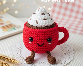 May include: A crocheted red coffee cup with a smiling face, black eyes, and brown feet. The cup is topped with white whipped cream and chocolate sprinkles. The text "PDF PATTERN" is in white letters.