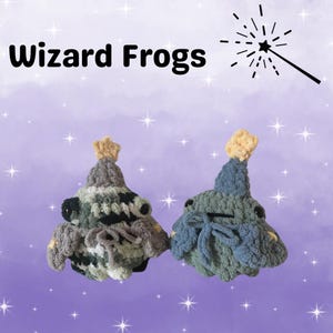 May include: Two crocheted frog plushies wearing party hats. The frog on the left is green, black, and white. The frog on the right is blue and green. The background is a purple and white starry sky with a magic wand.