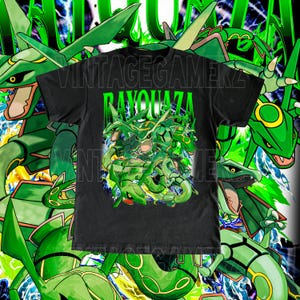 May include: Black t-shirt featuring a green graphic of a dragon-like creature with the text "RAYQUAZA" in green. The shirt also has the text "VINTAGE GAMERZ" in green. The background is a green and blue design.