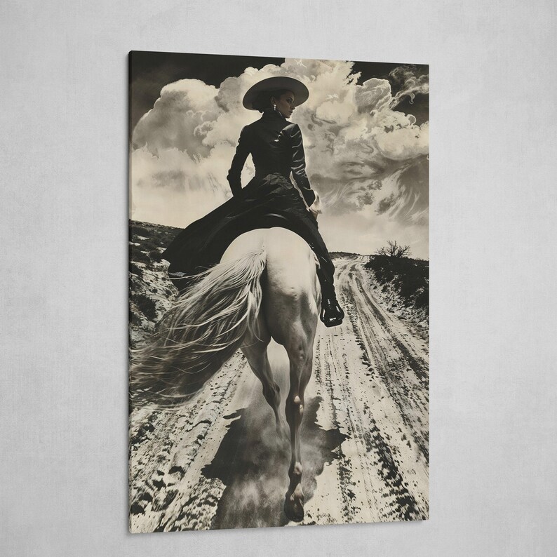 May include: Black and white print of a person riding a white horse on a dirt road. The person is wearing a wide-brimmed hat and a long black dress. The sky is filled with dramatic clouds, creating a vintage, western aesthetic.