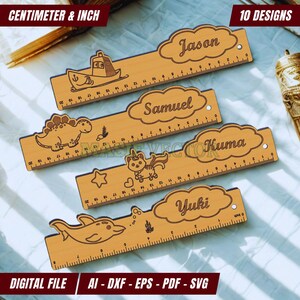 May include: Wooden rulers with engraved designs, including a boat, dinosaur, unicorn, and dolphin. Each ruler has a name and inch/centimeter markings. The image also includes the text "CENTIMETER & INCH" and "10 DESIGNS".