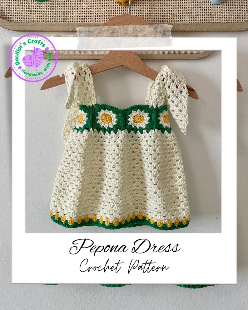 May include: A cream-coloured, handmade crochet dress with daisy accents in green and yellow. The dress has a square neckline and straps, with the text "Pepona Dress Crochet Pattern" at the bottom.