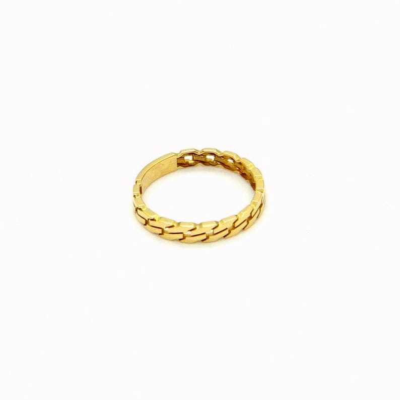 May include: A gold ring with a chain-link design.