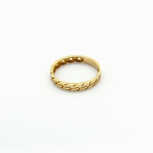 May include: A gold ring with a chain-link design.