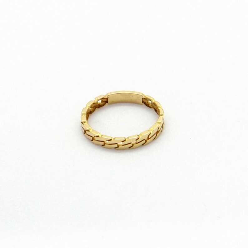 May include: A gold ring with a chain-link design.