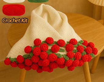 May include: Crochet kit with three skeins of yarn in white, green, and red. The kit includes instructions for crocheting a blanket with a border of red roses.