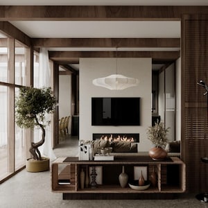 May include: A modern living room with a minimalist design. Features include a built-in fireplace, a large flat-screen TV, and a low wooden console. The room is illuminated by natural light from large windows and a unique pendant light.