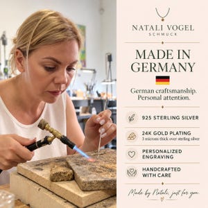 May include: A jewelry maker uses a handheld torch to heat a metal piece on a stone block. The text reads: NATALI VOGEL SCHMUCK, MADE IN GERMANY, German craftsmanship. Personal attention., 925 STERLING SILVER, 24K GOLD PLATING 3 microns thick over sterling silver, PERSONALIZED ENGRAVING, HANDCRAFTED WITH CARE, Made by Natali, just for you.