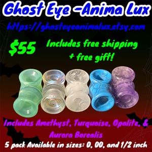 May include: Five pairs of colorful glass ear gauges in various colors, including turquoise, purple, and green. The gauges are available in sizes 0, 00, and 1/2 inch. The text "Ghost Eye - Anima Lux" and "https://ghosteyeanimalux.etsy.com" is visible in the image.