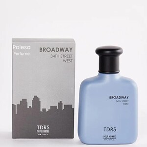May include: A light blue perfume bottle with a black cap and matching box. The box features a cityscape silhouette and the words "BROADWAY 34TH STREET WEST" and "TDRS POUR HOMME". The bottle also has the same text.
