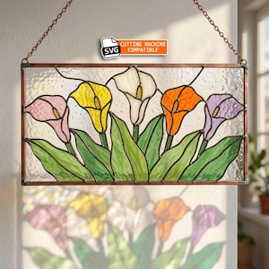 May include: A rectangular stained glass panel featuring five calla lilies in pink, yellow, white, orange, and purple with green leaves. The piece is framed in copper and hangs from a matching metal chain. Text reads SVG CUTTING MACHINE COMPATIBLE.