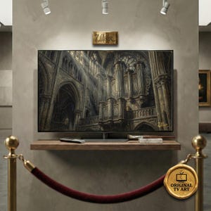 May include: A large, flat-screen TV displaying a detailed image of a cathedral interior with sunlight streaming through the windows. The TV is mounted on a wooden shelf with a remote and art supplies. A gold plaque above the TV reads "Ullver".