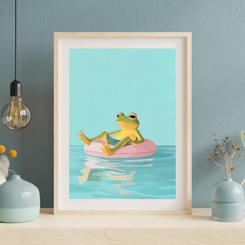 May include: A green frog wearing blue shorts floats on a pink inflatable ring in a blue pool. The frog is looking to the right and has its legs outstretched.