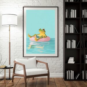 May include: A green frog wearing a blue swimsuit floats on a pink inflatable ring in a blue pool. The frog is looking to the right. The background is a light blue.