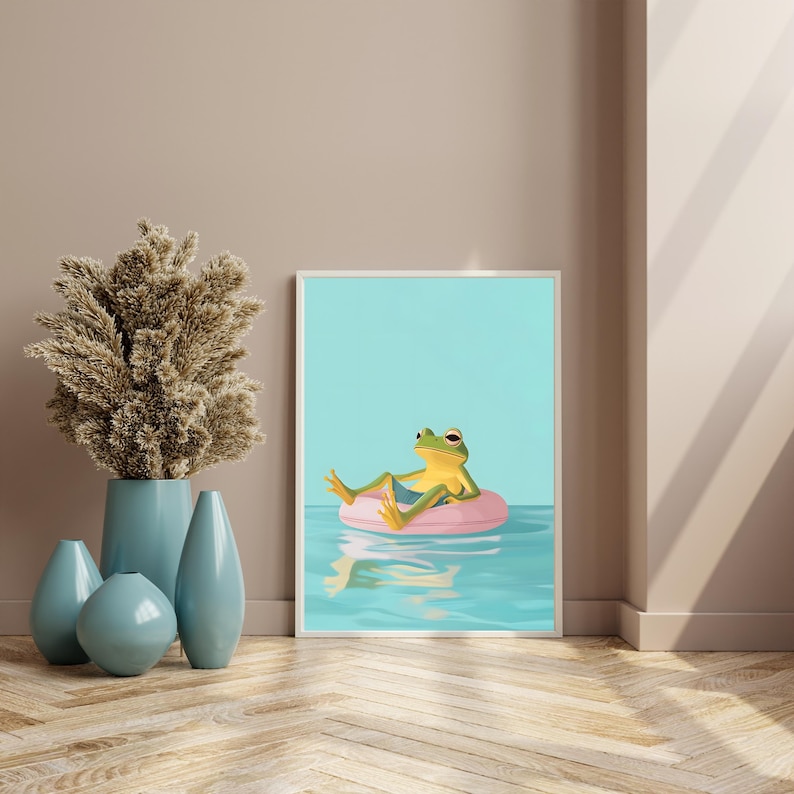 May include: A green frog wearing a blue swimsuit floats on a pink inflatable ring in a blue pool. The frog is looking to the right and has its legs crossed. The background is a light blue.