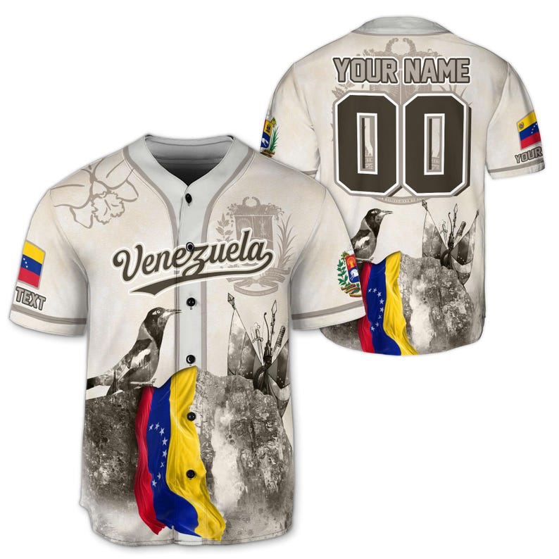 May include: A baseball jersey with the word "Venezuela" in script. The jersey is off-white with a gray collar and buttons. The front features a flag graphic and a bird. The back has the text "YOUR NAME" above the number "00".