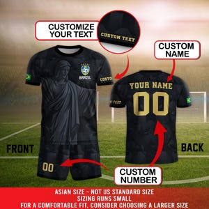 May include: Black soccer jersey and shorts set with gold accents. The jersey features a statue graphic and the text "BRAZIL". The back of the jersey displays "YOUR NAME" and the number "00". The image includes text that says "CUSTOMIZE YOUR TEXT", "CUSTOM NAME", and "CUSTOM NUMBER".