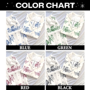 May include: A color chart displaying four sets of two-piece pajama sets in blue, green, red, and black. Each set features a white base with a repeating toile-style print of a dog, floral elements, and butterflies on the shirt and pants.