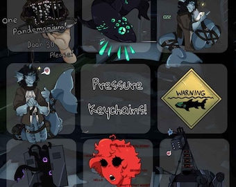 May include: A set of nine colorful keychains featuring various cartoon characters and designs. The keychains include a shark, a monster, a locker, a robot, and a creature with red hair. The text "Pressure Keychains!" is written in white letters on a black background.