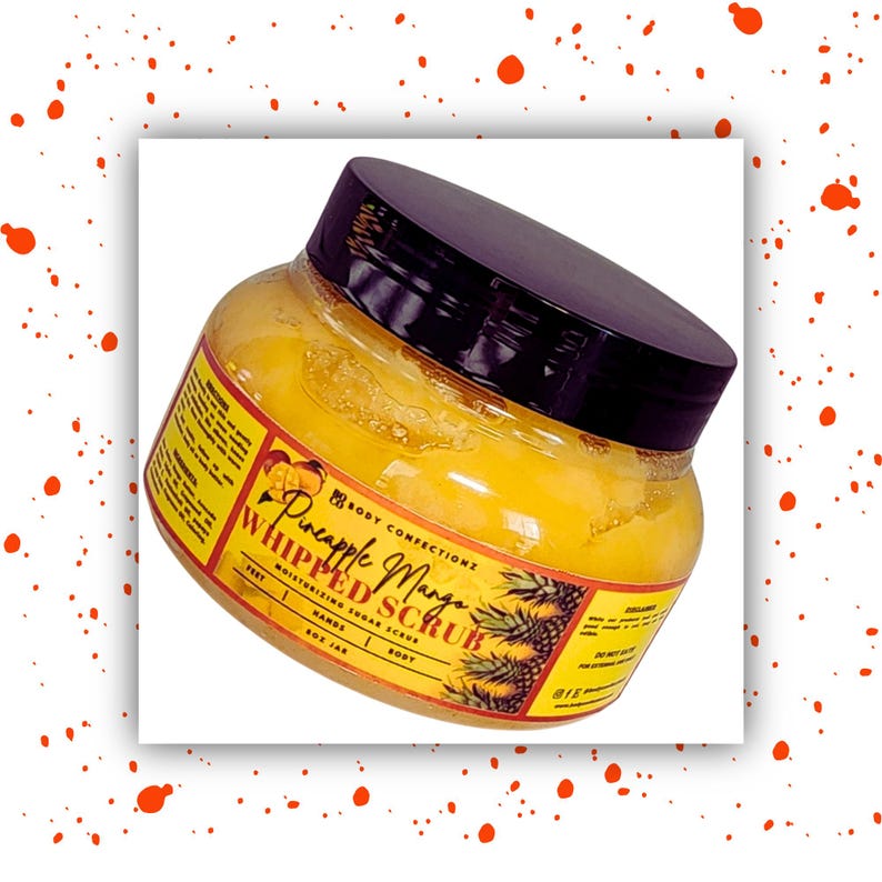 May include: A yellow jar of Pineapple Mango Whipped Scrub by Body Conections. The jar has a black lid and a label with a pineapple and mango design.