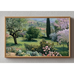 Peut inclure: Une peinture de paysage dans un cadre doré représentant un jardin verdoyant avec des roses roses en fleurs, des arbres en fleurs et un grand cyprès. L'arrière-plan montre des collines, des champs lointains et un petit village sous un ciel doux.