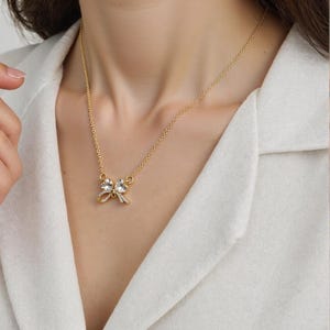 Dainty Gold Bow Necklace: Heart Cubic Zirconia Pendant