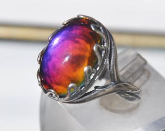 anillo de cristal naranja púrpura reflectante