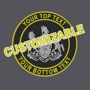 May include: A circular emblem featuring a black background with a yellow border. The center displays a grey coat of arms with the text VIRTUE LIBERTY AND INDEPENDENCE. The words YOUR TOP TEXT, CUSTOMIZABLE, and YOUR BOTTOM TEXT are printed in yellow.
