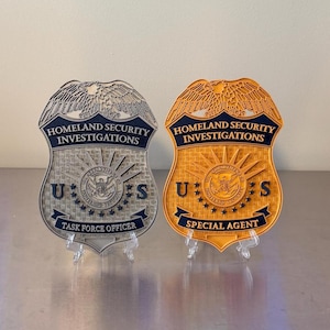 May include: A set of three ceramic mugs with a speckled, matte finish. The mugs are in shades of cream, light gray, and dark gray. Each mug has a simple, minimalist design, perfect for coffee or tea.