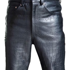 May include: Black leather trousers with a crocodile print.