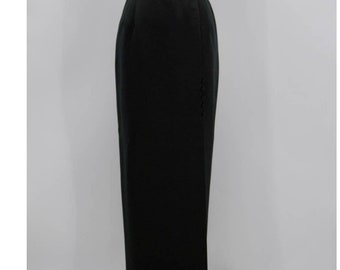 May include: A black maxi skirt with a side button closure. The skirt is made of a smooth, woven fabric.