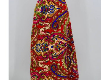 May include: A long red skirt with a paisley pattern in shades of blue, green, pink, and yellow.
