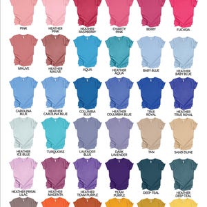 May include: Colour chart displaying 30 different colours of Bella Canvas 3001 Unisex T-Shirts. The colours are arranged in rows and columns, with the name of each colour printed below the corresponding shirt.